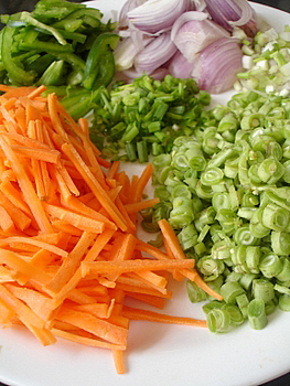 Chopped vegetables ready to be coated  with oil and seasonings.