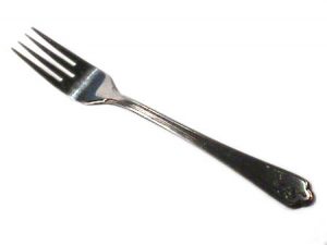 A typical dinner fork is found at most tables. But a bigger one could help you eat less.