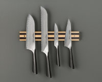 A typical knife set on a magnetic strip on the wall, a good way to store good knives.