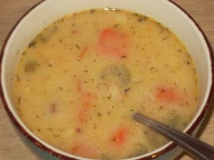 Ham and potato soup in a bowl.