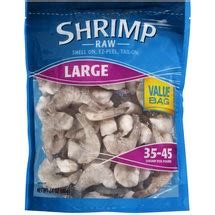 Large frozen raw shrimp in the package.