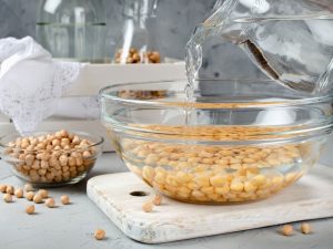 Soak your beans with some salt overnight. Make sure the beans are covered by about an inch of water.