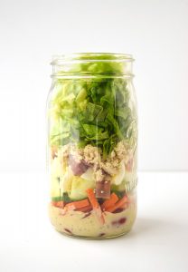 This Mason jar version of a cobb salad shows the way to layer the ingredients to store until you're ready to eat.